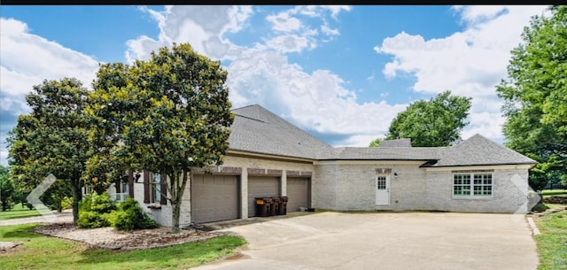1205 Sequoya Trl, Columbia, TN 38401 - view of front of property with brick siding, an attached garage, concrete driveway, and a shingled roof