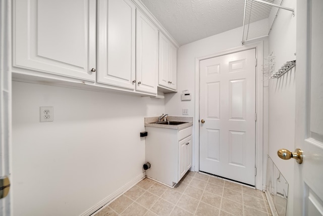 122 Belmont Cir, Hendersonville, TN 37075 - laundry room featuring cabinet space, baseboards, and a textured ceiling