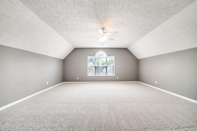 122 Belmont Cir, Hendersonville, TN 37075 - additional living space featuring ceiling fan, baseboards, carpet floors, vaulted ceiling, and a textured ceiling