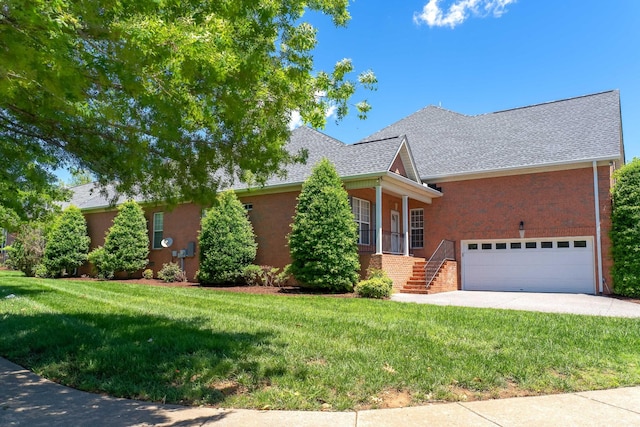 122 Belmont Cir, Hendersonville, TN 37075 - view of front of home featuring a front yard, brick siding, driveway, a shingled roof, and an attached garage