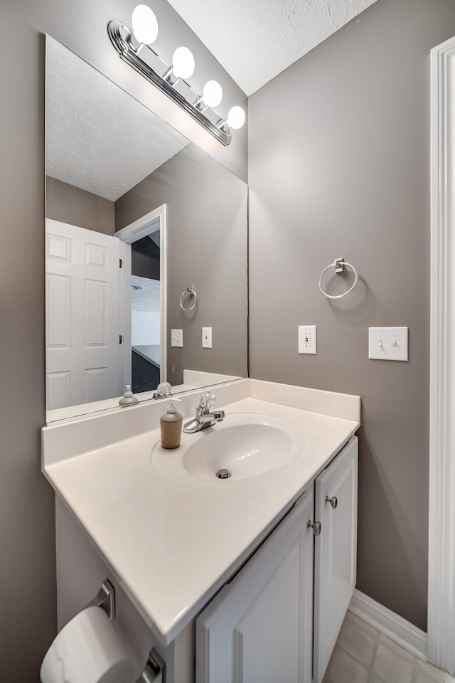 122 Belmont Cir, Hendersonville, TN 37075 - bathroom with vanity, a textured ceiling, baseboards, and tile patterned flooring