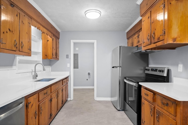 101 Charlemagne Blvd, Clarksville, TN 37042 - kitchen with appliances with stainless steel finishes, a sink, brown cabinetry, electric panel, and light countertops