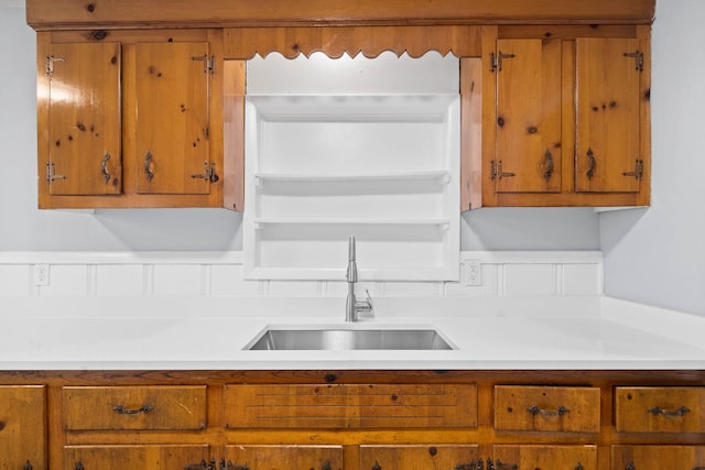 101 Charlemagne Blvd, Clarksville, TN 37042 - kitchen with a sink, brown cabinetry, and light countertops