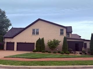 1200 Charles Reed Ct, Gallatin, TN 37066 - view of property exterior with concrete driveway and a lawn