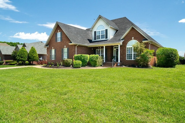 2317 Saint Andrews Dr, Murfreesboro, TN 37128 - traditional home featuring brick siding, a front lawn, and roof with shingles