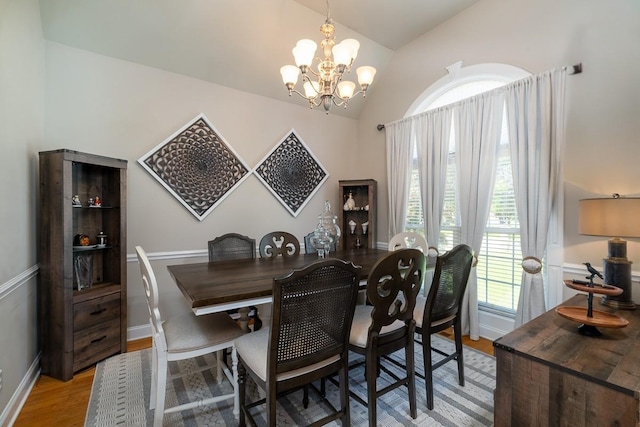 2317 Saint Andrews Dr, Murfreesboro, TN 37128 - dining room featuring a chandelier, lofted ceiling, light wood-style floors, and baseboards