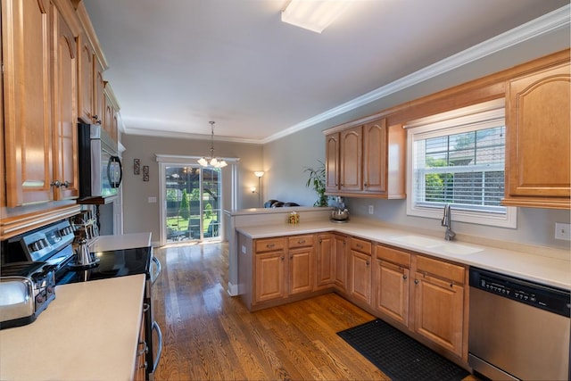 2317 Saint Andrews Dr, Murfreesboro, TN 37128 - kitchen with stainless steel appliances, a sink, a chandelier, dark wood-type flooring, and a peninsula