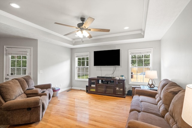 324 Airport Rd, Portland, TN 37148 - living room featuring a tray ceiling, light wood-style floors, ornamental molding, a ceiling fan, and baseboards