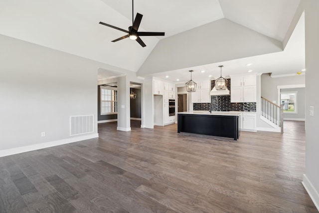 2200 Hamilton Chambers Rd, Lebanon, TN 37087 - unfurnished living room featuring ceiling fan, recessed lighting, wood finished floors, baseboards, and a sink