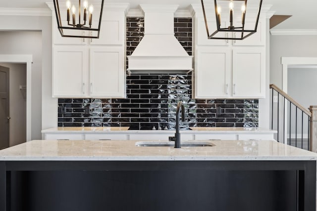 2200 Hamilton Chambers Rd, Lebanon, TN 37087 - kitchen with a chandelier, a sink, decorative backsplash, crown molding, and white cabinetry