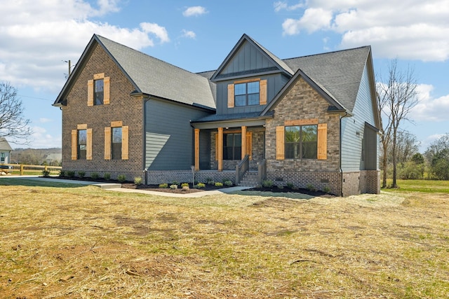2200 Hamilton Chambers Rd, Lebanon, TN 37087 - craftsman-style house with board and batten siding, covered porch, a front lawn, and roof with shingles