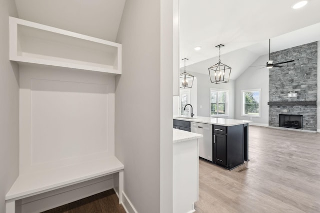 2200 Hamilton Chambers Rd, Lebanon, TN 37087 - mudroom featuring vaulted ceiling, light wood-style floors, ceiling fan, a fireplace, and a sink