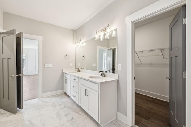 2200 Hamilton Chambers Rd, Lebanon, TN 37087 - full bath featuring double vanity, marble finish flooring, baseboards, and a walk in closet