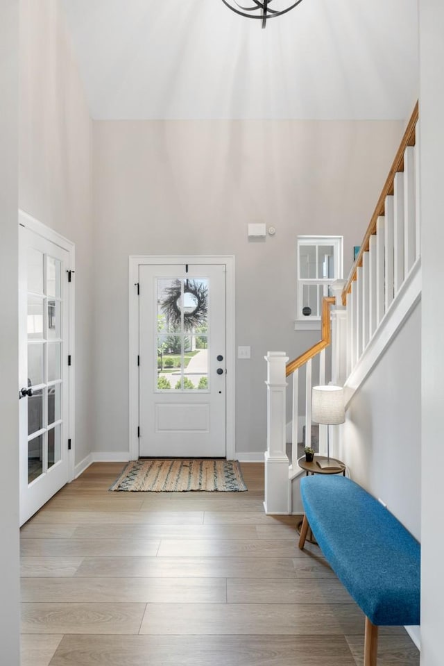 883 Plowson Rd, Mount Juliet, TN 37122 - foyer with a towering ceiling, wood finished floors, stairway, and baseboards