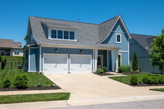 883 Plowson Rd, Mount Juliet, TN 37122 - view of front of property featuring board and batten siding, driveway, roof with shingles, and an attached garage
