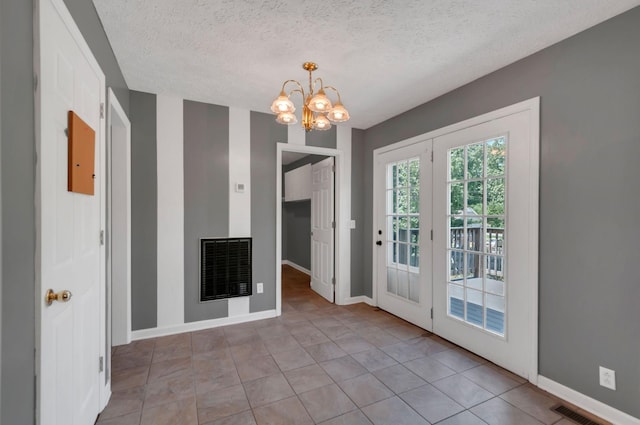 7108 Gregory Ct, Fairview, TN 37062 - unfurnished dining area with a chandelier, baseboards, a textured ceiling, and tile patterned flooring