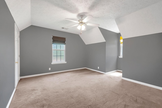 7108 Gregory Ct, Fairview, TN 37062 - additional living space with a ceiling fan, lofted ceiling, carpet, a textured ceiling, and baseboards