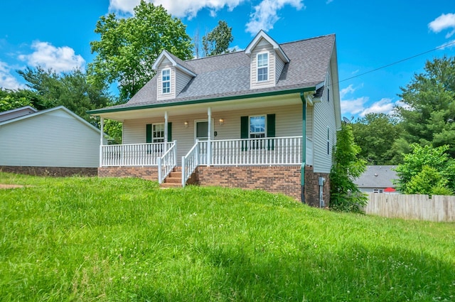 7108 Gregory Ct, Fairview, TN 37062 - new england style home featuring roof with shingles, covered porch, and a front yard