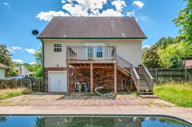 7108 Gregory Ct, Fairview, TN 37062 - back of property featuring a patio area, a deck, stairway, and a fenced backyard