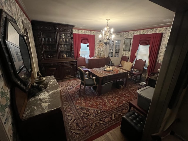 1802 Glen Oaks Ln, Dyersburg, TN 38024 - dining space with wallpapered walls, a chandelier, wood finished floors, plenty of natural light, and crown molding