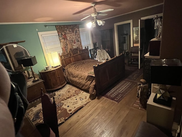 1802 Glen Oaks Ln, Dyersburg, TN 38024 - bedroom with wood finished floors, crown molding, and ceiling fan