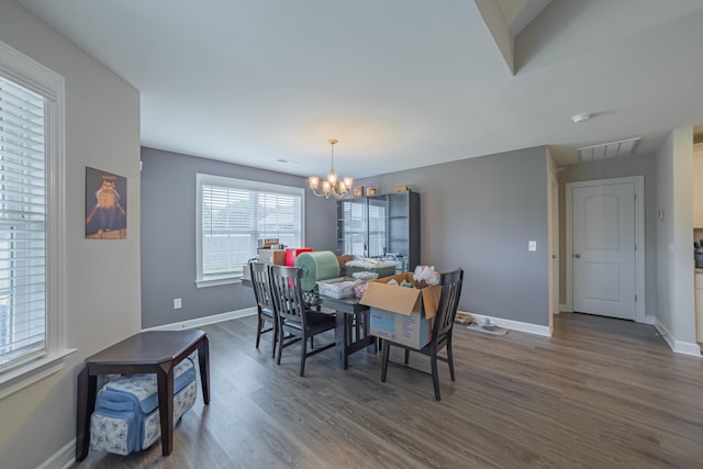 82 Pinnacle Point Ln, Tullahoma, TN 37388 - dining room featuring a chandelier, dark wood-style flooring, and baseboards