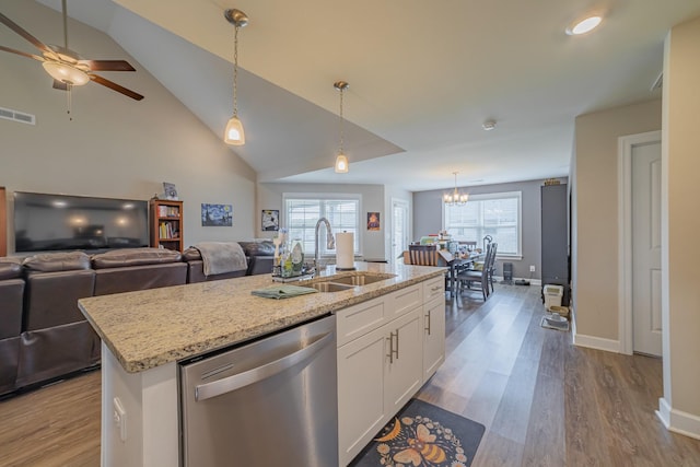 82 Pinnacle Point Ln, Tullahoma, TN 37388 - kitchen with dishwasher, a sink, open floor plan, wood finished floors, and vaulted ceiling