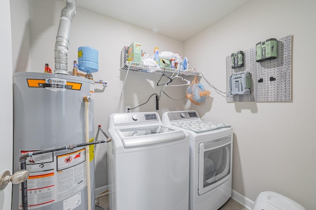 82 Pinnacle Point Ln, Tullahoma, TN 37388 - laundry area featuring gas water heater, washing machine and clothes dryer, and baseboards