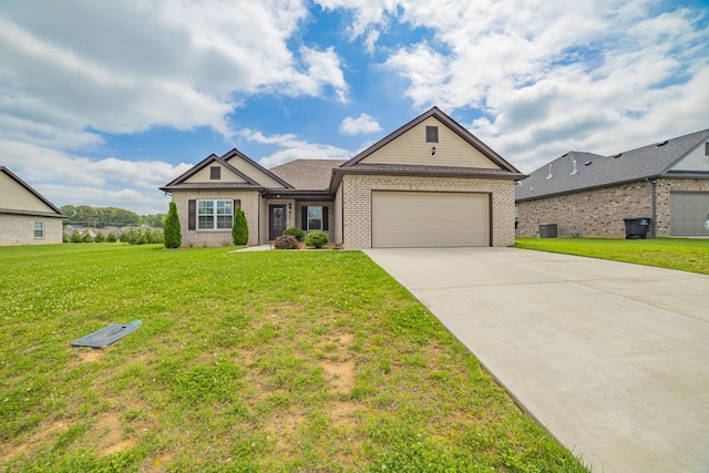 82 Pinnacle Point Ln, Tullahoma, TN 37388 - view of front facade featuring brick siding, an attached garage, concrete driveway, and a front lawn
