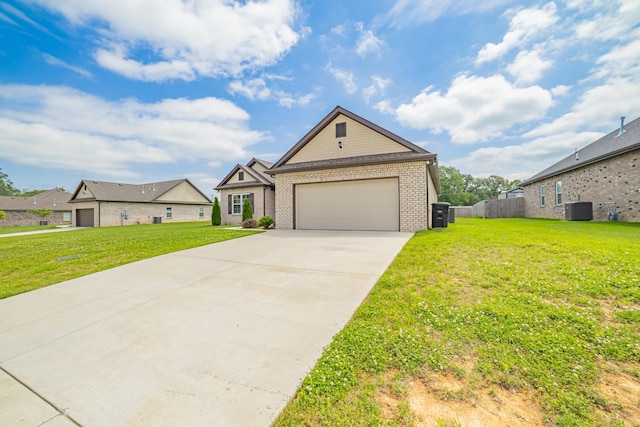 82 Pinnacle Point Ln, Tullahoma, TN 37388 - view of front of house featuring cooling unit, brick siding, driveway, and an attached garage