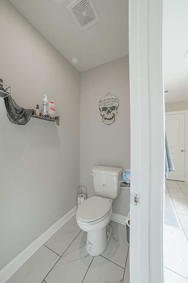 82 Pinnacle Point Ln, Tullahoma, TN 37388 - bathroom with marble finish floors, toilet, and baseboards