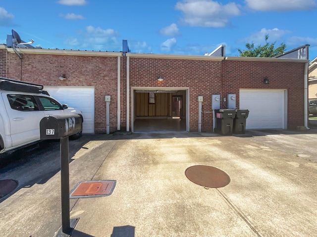 137 Dean St, Pleasant View, TN 37146 - view of property with brick siding, driveway, and an attached garage