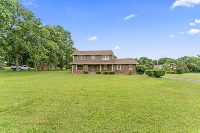 191 Green Harbor Rd, Old Hickory, TN 37138 - view of front facade with a front yard, brick siding, and a shed