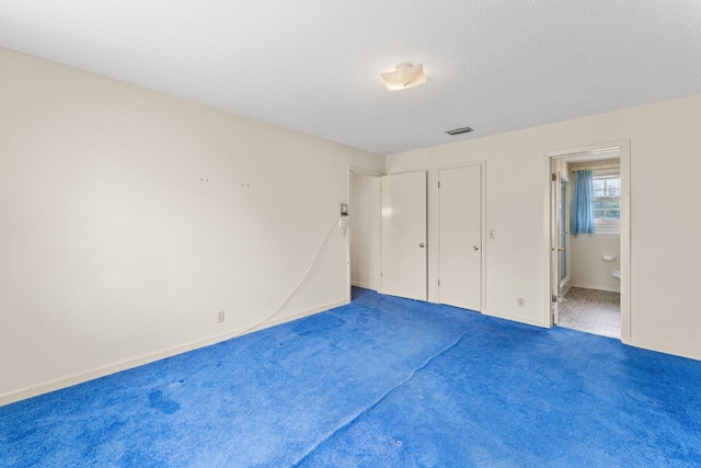 191 Green Harbor Rd, Old Hickory, TN 37138 - unfurnished bedroom with carpet floors, ensuite bathroom, and a textured ceiling