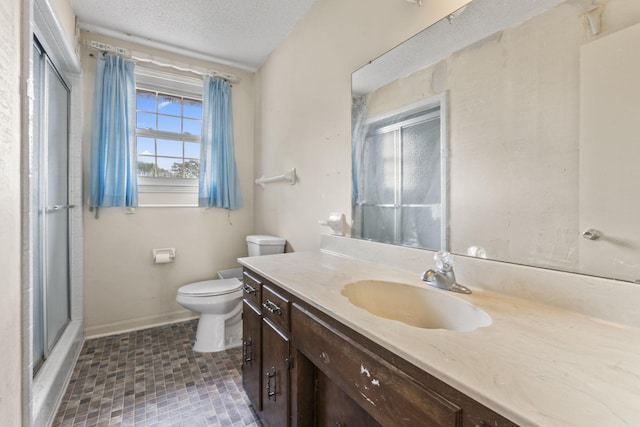 191 Green Harbor Rd, Old Hickory, TN 37138 - bathroom featuring vanity, a shower with door, and a textured ceiling
