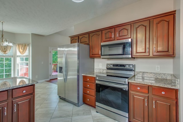 5409 Oak Chase Dr, Antioch, TN 37013 - kitchen featuring stainless steel appliances, a chandelier, pendant lighting, light stone countertops, and light marble finish flooring