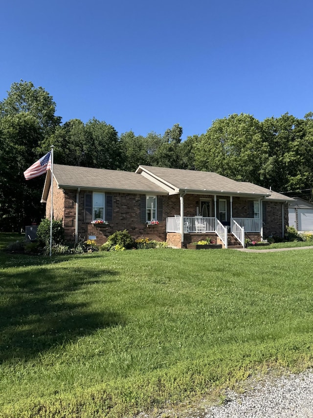 3 Cedar Grove Ln, Lebanon, TN 37087 - ranch-style house with a porch, a front yard, brick siding, and a shingled roof