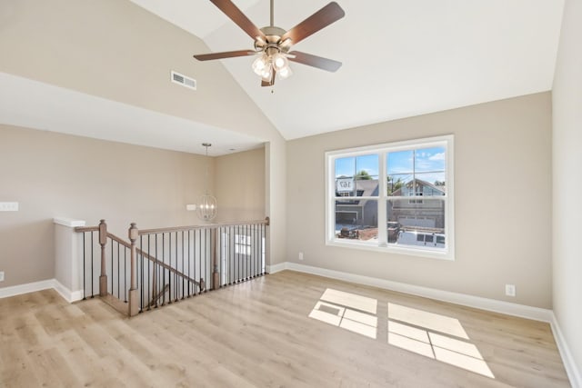 837 Macon Ln, Clarksville, TN 37042 - spare room with a chandelier, wood finished floors, high vaulted ceiling, baseboards, and ceiling fan