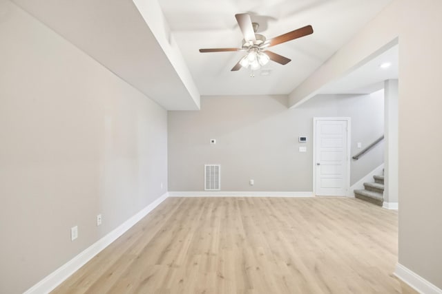 837 Macon Ln, Clarksville, TN 37042 - unfurnished living room featuring light wood finished floors, a ceiling fan, stairway, and baseboards