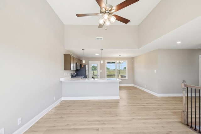 837 Macon Ln, Clarksville, TN 37042 - unfurnished living room featuring light wood finished floors, a chandelier, ceiling fan, baseboards, and recessed lighting