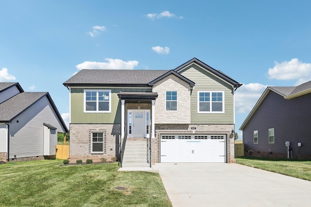 837 Macon Ln, Clarksville, TN 37042 - view of front facade featuring brick siding, a garage, concrete driveway, and a front yard