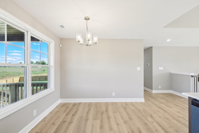 837 Macon Ln, Clarksville, TN 37042 - spare room with a chandelier, light wood-type flooring, baseboards, and recessed lighting