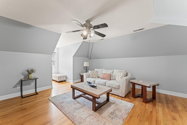 1408 Baker Ln, Lawrenceburg, TN 38464 - living area with vaulted ceiling, ceiling fan, light wood-style floors, and baseboards