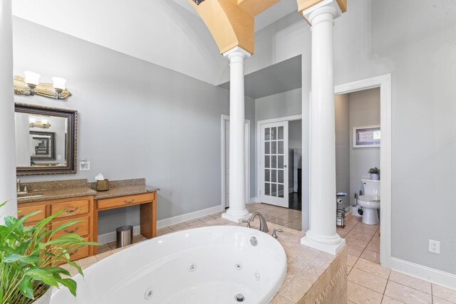 1408 Baker Ln, Lawrenceburg, TN 38464 - full bath with decorative columns, a jetted tub, tile patterned flooring, and toilet