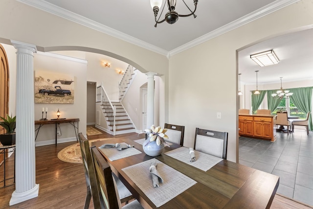 1408 Baker Ln, Lawrenceburg, TN 38464 - dining area featuring a chandelier, decorative columns, crown molding, stairs, and arched walkways