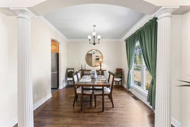 1408 Baker Ln, Lawrenceburg, TN 38464 - dining area featuring decorative columns, ornamental molding, a chandelier, arched walkways, and baseboards