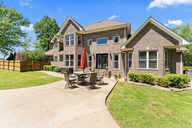 1408 Baker Ln, Lawrenceburg, TN 38464 - back of property with brick siding and a patio
