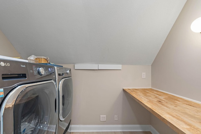 2974 W Mor Dr, Clarksville, TN 37043 - washroom with washer and dryer and baseboards