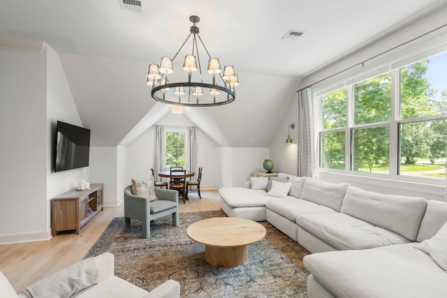 2974 W Mor Dr, Clarksville, TN 37043 - living room featuring light wood finished floors, a chandelier, baseboards, and vaulted ceiling