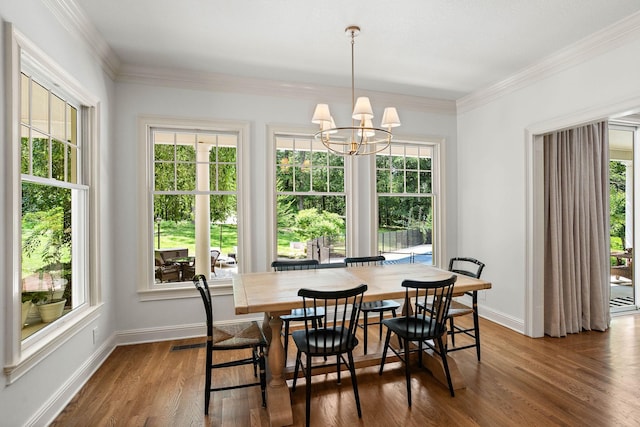 2974 W Mor Dr, Clarksville, TN 37043 - dining area featuring dark wood-type flooring, healthy amount of natural light, baseboards, a chandelier, and crown molding